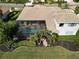 Aerial view of the home showcasing the tile roof, screened pool, and manicured yard at 505 Sand Crane Ct, Bradenton, FL 34212