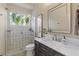 Modern bathroom features glass-enclosed shower with patterned tile and marble countertop vanity at 505 Sand Crane Ct, Bradenton, FL 34212