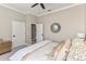 Bedroom with carpet, crown molding, ceiling fan, and doorways to closet and hall at 505 Sand Crane Ct, Bradenton, FL 34212
