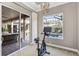 Exercise bike in room with sliding door and views of pool and backyard at 505 Sand Crane Ct, Bradenton, FL 34212