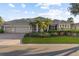 Attractive single-story home with a three-car garage, tidy landscaping, and classic architectural details at 505 Sand Crane Ct, Bradenton, FL 34212