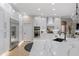 Modern kitchen featuring white cabinets, stainless steel appliances, quartz countertop, and an island sink at 505 Sand Crane Ct, Bradenton, FL 34212