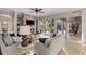 Open living room featuring a fireplace with stone surround and a view of the backyard pool at 505 Sand Crane Ct, Bradenton, FL 34212