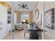 Office space has a ceiling fan, comfortable seating, and a dark wood desk at 505 Sand Crane Ct, Bradenton, FL 34212