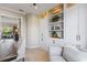Home office featuring a large built-in bookshelf and comfortable seating at 505 Sand Crane Ct, Bradenton, FL 34212