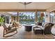 Relaxing outdoor patio featuring comfortable seating, fire pit, screened enclosure, and swimming pool at 505 Sand Crane Ct, Bradenton, FL 34212