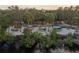 Scenic lake view showcasing a kayak launch offering a variety of kayaks in a waterfront community at 505 Sand Crane Ct, Bradenton, FL 34212