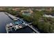 Birds-eye view of a boat dock offering deep water access and a waterfront property with a pool at 505 Sand Crane Ct, Bradenton, FL 34212