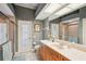 Bathroom with walk-in shower and single sink vanity at 5112 White Ibis Dr, North Port, FL 34287