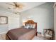 Cozy bedroom with a comfortable bed and ceiling fan at 5112 White Ibis Dr, North Port, FL 34287