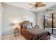 Bright bedroom with sliding glass doors leading to patio at 5112 White Ibis Dr, North Port, FL 34287