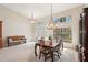 Spacious dining area, featuring a large table and ample natural light at 5112 White Ibis Dr, North Port, FL 34287
