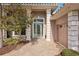Elegant entryway with light teal door and paver walkway at 5112 White Ibis Dr, North Port, FL 34287