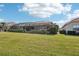 Beautiful home exterior with lush landscaping and a large lawn at 5112 White Ibis Dr, North Port, FL 34287