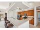 U-shaped kitchen with wood cabinets, granite countertops, and island with seating at 5112 White Ibis Dr, North Port, FL 34287