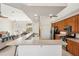 Modern kitchen with wood cabinets and a large island at 5112 White Ibis Dr, North Port, FL 34287