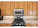 Kitchen with stainless steel microwave and gas cooktop at 5112 White Ibis Dr, North Port, FL 34287