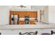 Modern kitchen features stainless steel appliances and ample wood cabinetry at 5112 White Ibis Dr, North Port, FL 34287