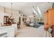 Spacious living area with high ceilings and access to kitchen at 5112 White Ibis Dr, North Port, FL 34287
