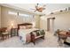 Large main bedroom with king-size bed and sitting area at 5112 White Ibis Dr, North Port, FL 34287