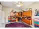 Bright home office with built-in shelving and large window at 5112 White Ibis Dr, North Port, FL 34287