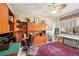 Home office with built-in wooden shelving and desk at 5112 White Ibis Dr, North Port, FL 34287