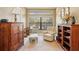Home office with built-in wooden shelving and comfortable seating at 5112 White Ibis Dr, North Port, FL 34287