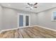 Bedroom with hardwood floors, ceiling fan and French doors at 5118 6Th Avenue W Dr, Bradenton, FL 34209