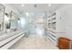 Elegant bathroom with marble flooring, double vanity and glass shower at 5235 Siesta Cove Dr, Sarasota, FL 34242