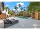 Spacious pool and patio with lounge chairs and a sauna at 5235 Siesta Cove Dr, Sarasota, FL 34242