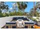 Relaxing rooftop terrace with fire pit and comfortable seating area at 5235 Siesta Cove Dr, Sarasota, FL 34242