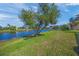 Serene backyard oasis with lake view and ample green space at 531 Latitude Ln, Osprey, FL 34229
