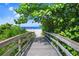 Scenic wooden boardwalk leads to the beach at 531 Latitude Ln, Osprey, FL 34229