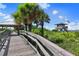 Wooden walkway to the beach with lifeguard tower at 531 Latitude Ln, Osprey, FL 34229