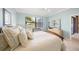 Bright bedroom with neutral decor, comfortable bedding, and plenty of closet space at 531 Latitude Ln, Osprey, FL 34229