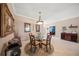 Charming dining room with glass-top table and four chairs at 531 Latitude Ln, Osprey, FL 34229