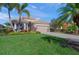 Single-story home with attractive landscaping and two-car garage at 531 Latitude Ln, Osprey, FL 34229