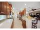 Well-equipped kitchen with granite countertops, custom cabinetry, and breakfast bar at 531 Latitude Ln, Osprey, FL 34229