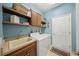 Convenient laundry room with washer, dryer, and utility sink at 531 Latitude Ln, Osprey, FL 34229