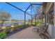 Relaxing screened porch overlooking a tranquil lake at 531 Latitude Ln, Osprey, FL 34229