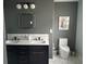 Modern bathroom with double vanity, hexagon tile, and updated fixtures at 5317 19Th S Ave, Gulfport, FL 33707