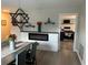 Bright dining area with electric fireplace and view into the kitchen at 5317 19Th S Ave, Gulfport, FL 33707