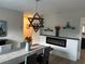 Elegant dining room with modern fireplace, chandelier, and built-in shelving at 5317 19Th S Ave, Gulfport, FL 33707
