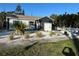 Cute bungalow with updated facade, landscaping, and a white picket fence at 5317 19Th S Ave, Gulfport, FL 33707