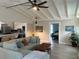 Open living room features vaulted ceilings, and a view into the kitchen at 5317 19Th S Ave, Gulfport, FL 33707