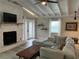Relaxing living room with stone fireplace and access to backyard at 5317 19Th S Ave, Gulfport, FL 33707