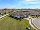 Single-story home with tile roof, two-car garage, and large backyard at 5439 Taliaferro Ct, Palmetto, FL 34221