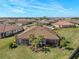 Aerial view of home showcasing backyard oasis and community at 5439 Taliaferro Ct, Palmetto, FL 34221