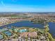 Aerial view of community amenities including pool, tennis courts, and clubhouse at 5439 Taliaferro Ct, Palmetto, FL 34221