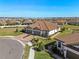 Single-story home with tile roof, two-car garage and grassy yard at 5439 Taliaferro Ct, Palmetto, FL 34221